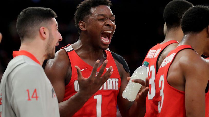 NEW YORK, NY - JANUARY 20: Jae'Sean Tate #1 of the Ohio State Buckeyes cheers from the sideline against the Minnesota Golden Gophers in the second half during their game at Madison Square Garden on January 20, 2018 in New York City.  (Photo by Abbie Parr/Getty Images)