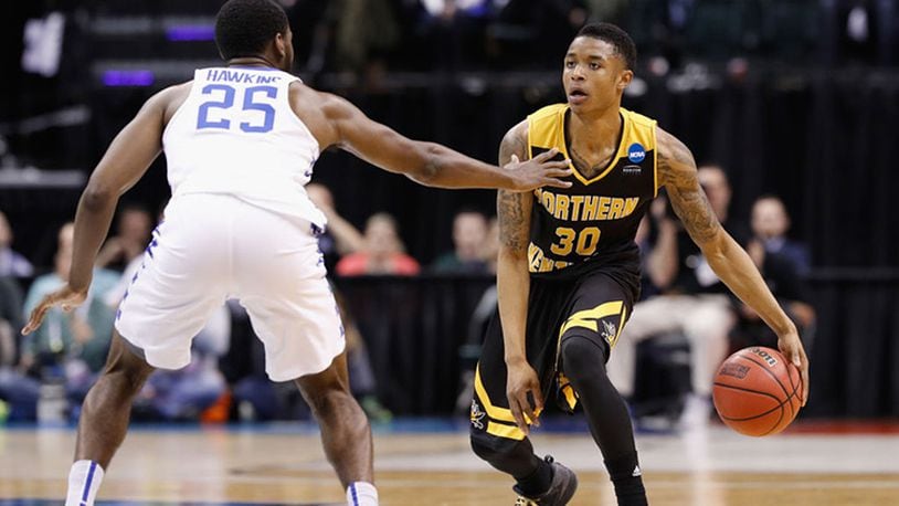 INDIANAPOLIS, IN - MARCH 17: Lavone Holland II #30 of the Northern Kentucky Norse dribbles against Dominique Hawkins #25 of the Kentucky Wildcats in the second half during the first round of the 2017 NCAA Men’s Basketball Tournament at Bankers Life Fieldhouse on March 17, 2017 in Indianapolis, Indiana. (Photo by Joe Robbins/Getty Images)