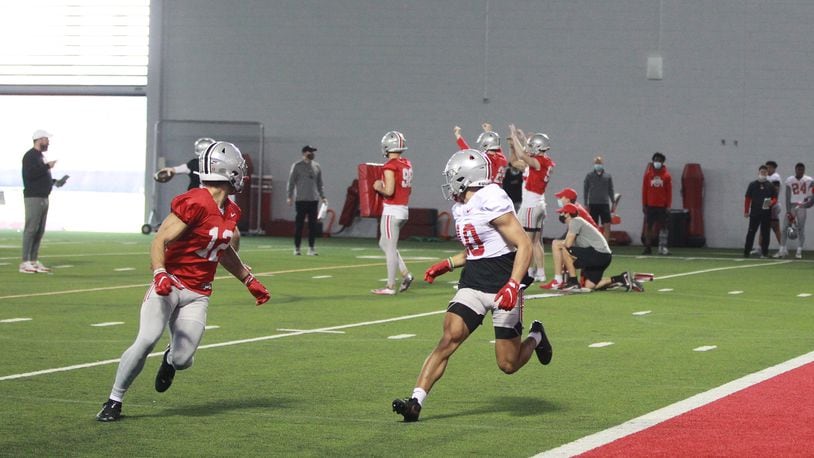 Emeka Ogbuka (left) and Cameron Martinez (10, right) face each other in Ohio State football practice.