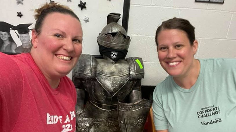 The Crabtree sisters, Stacie McConehea and Sarah Suarez say goodbye to the Greenon Knight in the Greenon High School office. Submitted photo
