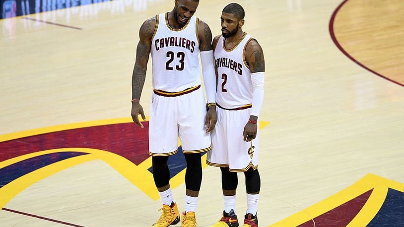 CLEVELAND, OH - MAY 17: LeBron James #23 and Kyrie Irving #2 of the Cleveland Cavaliers talk at mid court in the first half against the Toronto Raptors in game one of the Eastern Conference Finals during the 2016 NBA Playoffs at Quicken Loans Arena on May 17, 2016 in Cleveland, Ohio. NOTE TO USER: User expressly acknowledges and agrees that, by downloading and or using this photograph, User is consenting to the terms and conditions of the Getty Images License Agreement.  (Photo by Jason Miller/Getty Images)