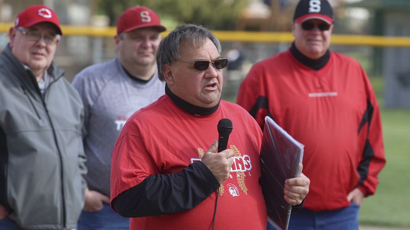 Southeastern High School softball coach Randy "Tojo" Delaney speaks to the crowd during a ceremony honoring his 500th victory before their game against Triad on Monday evening at South Charleston Park. Michael Cooper/CONTRIBUTED