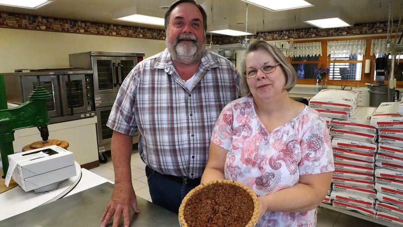 Chris and Sharon Stevens in their commercial kitchen where they make more than 20 varieties of pies. BILL LACKEY/STAFF