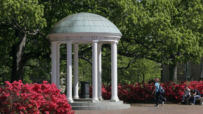 FILE - The Old Well on the University of North Carolina at Chapel Hill is seen among the spring foliage, April 20, 2015, in Chapel Hill, N.C. The future of diversity, equity and inclusion staff jobs in North Carolina's public university system could be at stake as a series of votes loom on a key policy's potential repeal. The Committee on University Governance within the University of North Carolina Board of Governors that oversees 17 schools, was poised to vote Wednesday, April 17, 2024, on a possible reversal and replacement of a policy related to DEI. (AP Photo/Gerry Broome, File)