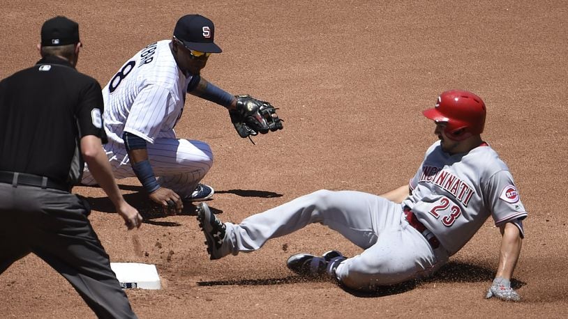 The Reds’ Adam Duvall slides into second base with a double ahead of the tag of the Padres’ Erick Aybar at PETCO Park on June 14, 2017 in San Diego, California. (Photo by Denis Poroy/Getty Images)