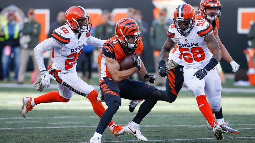 Cincinnati Bengals wide receiver Alex Erickson (12) runs the ball against Cleveland Browns outside linebacker Christian Kirksey (58) in the second half of an NFL football game, Sunday, Nov. 26, 2017, in Cincinnati. (AP Photo/Frank Victores)