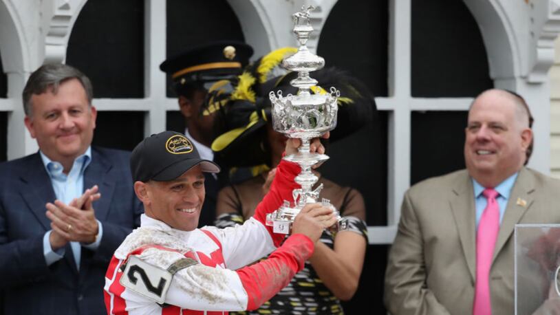 BALTIMORE, MD - MAY 20:  Javier Castellano #2 rider of Cloud Computing celebrates with the trophy alongside Baltimore City Stephanie Rawlings-Blake and Maryland Governor Larry Hogan after winning the 142nd running of the Preakness Stakes at Pimlico Race Course on May 20, 2017 in Baltimore, Maryland.  (Photo by Rob Carr/Getty Images)