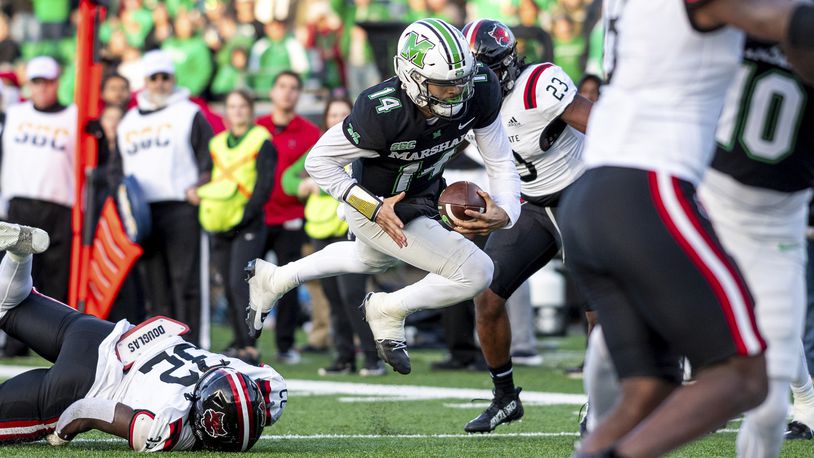 Marshall quarterback Cam Fancher (14) dives in for a rushing touchdown against Arkansas State during an NCAA college football game Saturday, Nov. 25, 2023, in Huntington, W.Va. (Sholten Singer/The Herald-Dispatch via AP)