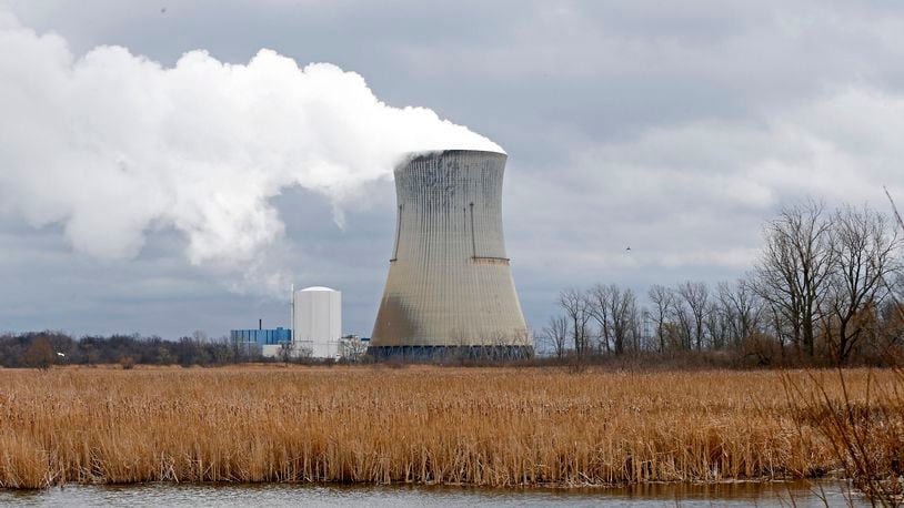 FILE - This April 4, 2017 file photo shows the then-FirstEnergy Corp.'s Davis-Besse Nuclear Power Station in Oak Harbor, Ohio. The fate of the legislation that aimed to bailout Ohio's two nuclear plants remains unclear as the Legislature meets for a final session Tuesday, Dec. 22, 2020, to discuss any potential bill that would remedy, delay or repeal portions of the legislation. (AP Photo/Ron Schwane, File)