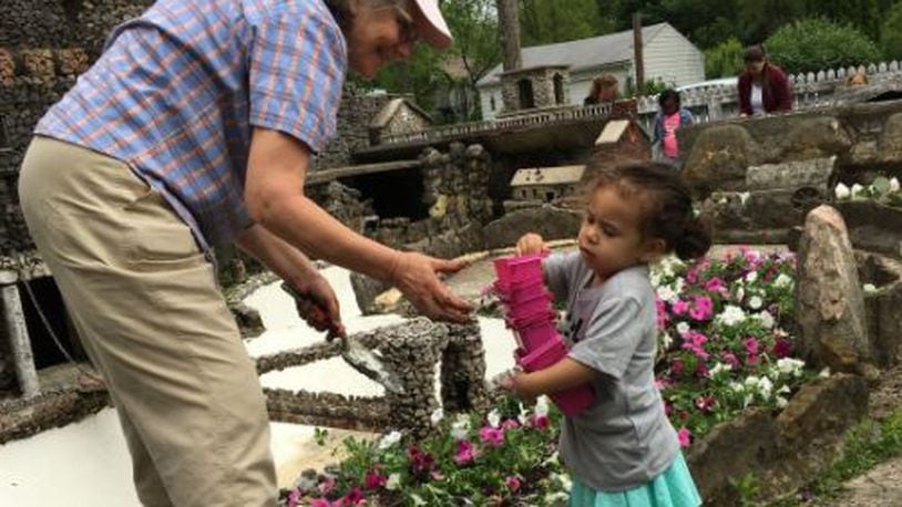 Juliana Longo offers volunteer worker Cheryl Keen assistance during the spring cleanup at Hartman Rock Garden. Brett Turner/Contributed