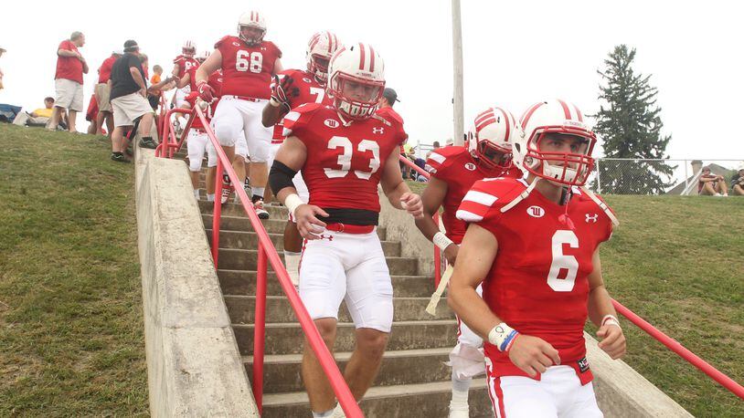 Wittenberg’s Jake Kennedy (6) and the Tigers walk to the field before a game against Wabash on Sept. 24, 2016, at Edwards-Maurer Field in Springfield. David Jablonski/Staff