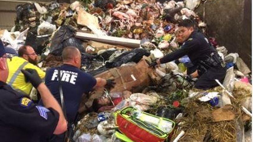 Crews at the Montgomery County Solid Waste Facility in Moraine on Tuesday morning discovered a man buried alive in garbage after a trash truck dumped its load. CONTRIBUTED