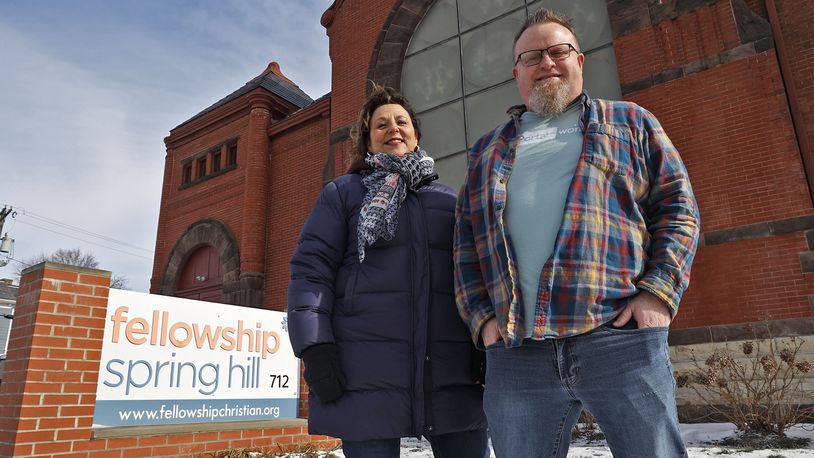 Tami Carter and Aaron Earlywine, with CarePortal, in front of Fellowship Spring Hill Church Friday, Jan. 27, 2023. CarePortal is a nonprofit online portal where churches and nonprofits help with emergency requests from local schools and agencies. BILL LACKEY/STAFF