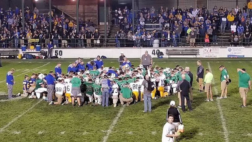 The St. Marys Memorial Roughriders invited the Celina Bulldogs to take a knee for an after-game prayer last Friday. For more than a year, the Roughriders have invited every opponent to join them after the game in prayer. CONTRIBUTED
