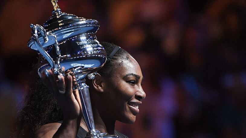 Serena Williams celebrates with the championship trophy after her victory against her sister, Venus Williams, in last January's final of the Australian Open.