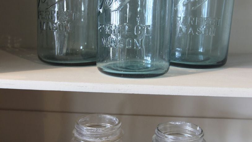 Once strictly utilitarian, familiar canning jars take on new decorative lives at the Funk Junk Boutique in Sevile, Ohio. (Michael Chritton/Akron Beacon Journal/TNS)