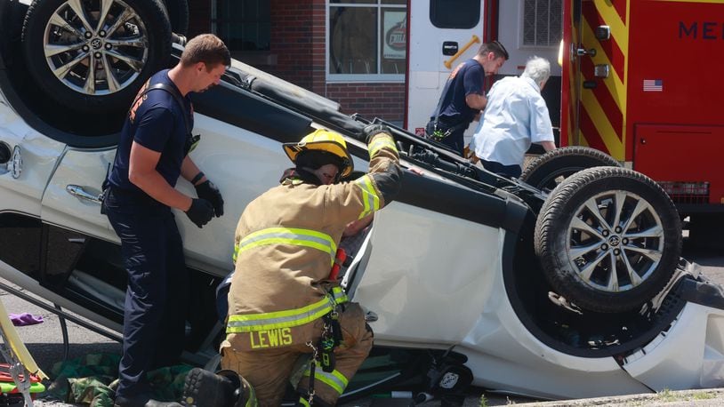 Three people were transported with non life-threatening injuries after a two-car accident at the intersection of West Main Street and North Lowry Avenue Friday, June 2, 2023. One of the cars flipped over and two passengers had to be rescued. BILL LACKEY/STAFF