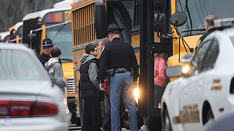 Students at Dennis Intermediate School in Richmond, Indiana, were transferred to Richmond High School Thursday morning, Dec. 13, 2018, where parents were able to pick them up after a 14-year-old boy fatally shot himself inside their school. MARSHALL GORBY/STAFF