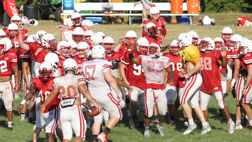Wittenberg players run to a huddle during practice on Wednesday, Aug. 21, 2019, in Springfield. David Jablonski/Staff