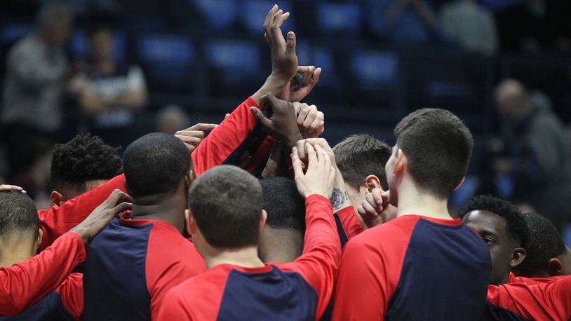 The Dayton Flyers huddle before a game at Rhode Island on Feb. 10, 2017, in Kingston, R.I.