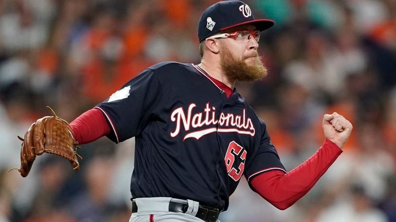 Washington Nationals' Sean Doolittle celebrates after Game 1 of the baseball World Series against the Houston Astros Tuesday, Oct. 22, 2019, in Houston. The Nationals won 5-4 to take a 1-0 lead in the series. (AP Photo/Eric Gay)