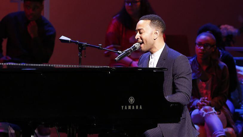 John Legend performs on stage during a concert following the ribbon cutting for the new John Legend Theater Sunday. Bill Lackey/Staff