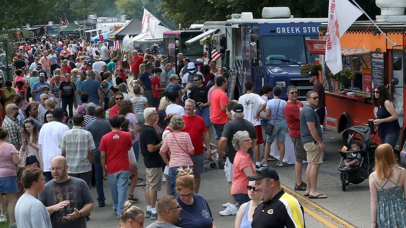 Veteran's Park was overflowing with people Saturday during the Springfield Rotary Gourmet Food Truck Competition. BILL LACKEY/STAFF