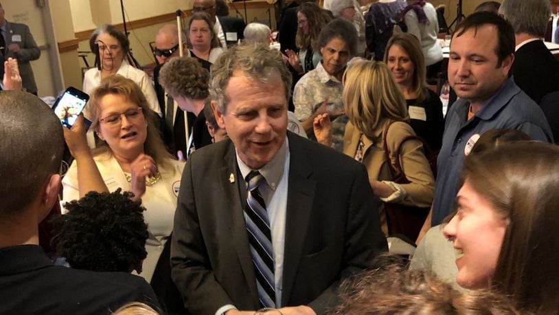 U.S. Sen. Sherrod Brown met with dozens of people to shake hands and take pictures following his keynote speech at the Clark County Democratic Party’s Annual Freedom Dinner at Courtyard by Marriott on Thursday. Photo by Brett Turner