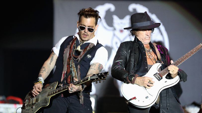 HERBORN, GERMANY - MAY 29: Actor/Musician Johnny Depp and Musician Joe Perry of Hollywood Vampires perform onstage at Hessentags-Arena during the 56th Hessentag on May 29, 2016 in Herborn, Germany. After Joe Perry collapsed at a Sunday night show in New York City, his band Hollywood Vampires played without him in Ohio . Perry's publicist has reported that the guitarist "will rejoin his fellow Vampires on stage again soon." (Photo by Andreas Rentz/Getty Images)