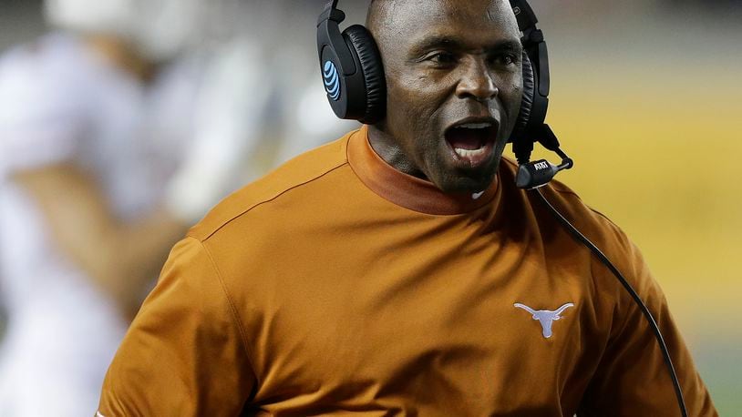 FILE - In this Saturday, Sept. 17, 2016, file photo, Texas coach Charlie Strong yells during the first quarter of an NCAA college football game against California in Berkeley, Calif. A person with direct knowledge of the decision tells The Associated Press that former Texas coach Strong has agreed to become the next coach at South Florida. The person spoke on condition of anonymity because the school was preparing a formal announcement for later Sunday, Dec. 11. (AP Photo/Ben Margot, File)