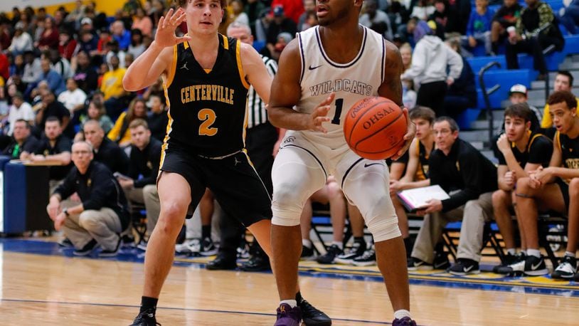 Springfield’s Larry Stephens dribbles past Centerville’s Drew Thompson during their game on Saturday night. The Elks won 52-36. CONTRIBUTED PHOTO BY MICHAEL COOPER
