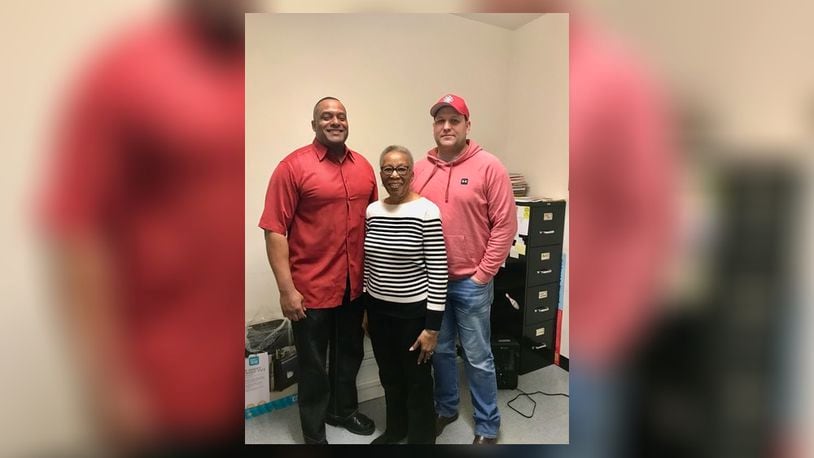 Fire Division Lieutenant and chaplain Bruce Kelley (left), Ella Barnes, Charles Barnes widow (middle), and International Association of Firefighters Local 333 (IAFF 333) President Kevin Sanders (right). Contributed
