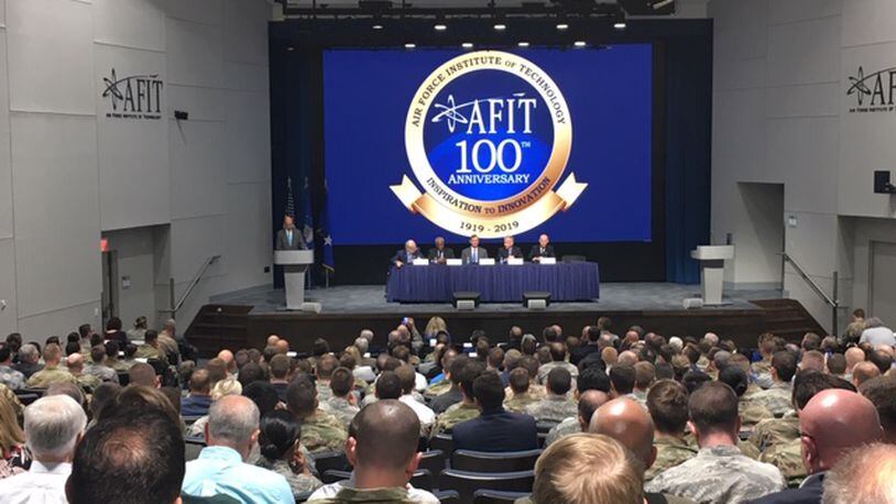 A standing-room-only audience hears a panel of five former astronauts with AFIT ties in the Kenny Hall Auditorium Thursday, in an event marking AFIT's 100th anniversary. The auditorium underwent a $4 million renovation recently. THOMAS GNAU/STAFF