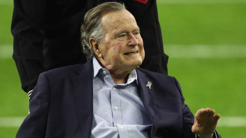 HOUSTON, TX - FEBRUARY 05:  President George H.W. Bush arrives for the coin toss prior to Super Bowl 51 between the Atlanta Falcons and the New England Patriots at NRG Stadium on February 5, 2017 in Houston, Texas.  (Photo by Patrick Smith/Getty Images)