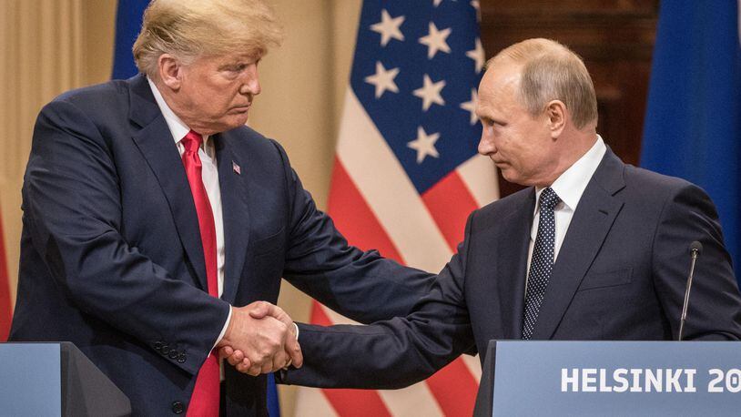HELSINKI, FINLAND - JULY 16: U.S. President Donald Trump (L) and Russian President Vladimir Putin shake hands during a joint press conference after their summit on July 16, 2018 in Helsinki, Finland. The two leaders met one-on-one and discussed a range of issues including the 2016 U.S Election collusion.  (Photo by Chris McGrath/Getty Images)