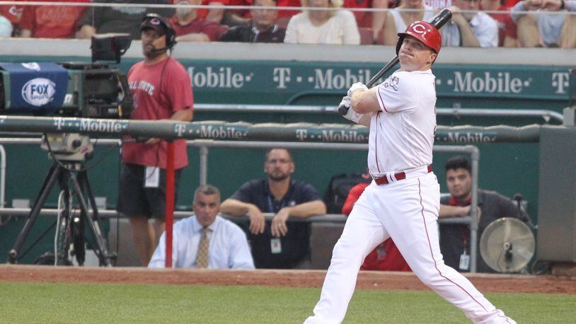 The Reds' Jay Bruce hits a two-run home run in the fourth inning against the Pirates on Wednesday, May 11, 2016, at Great American Ball Park in Cincinnati. David Jablonski/Staff