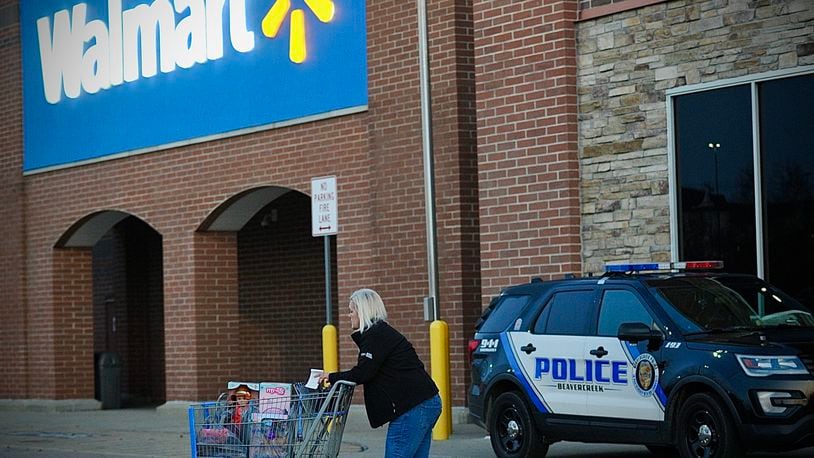 Five police cruisers sit outside the Beavercreek Walmart store on Black Friday, November 24, 2023. The store reopened that morning after a shooting there injured four people earlier in the week. MARSHALL GORBY \STAFF
