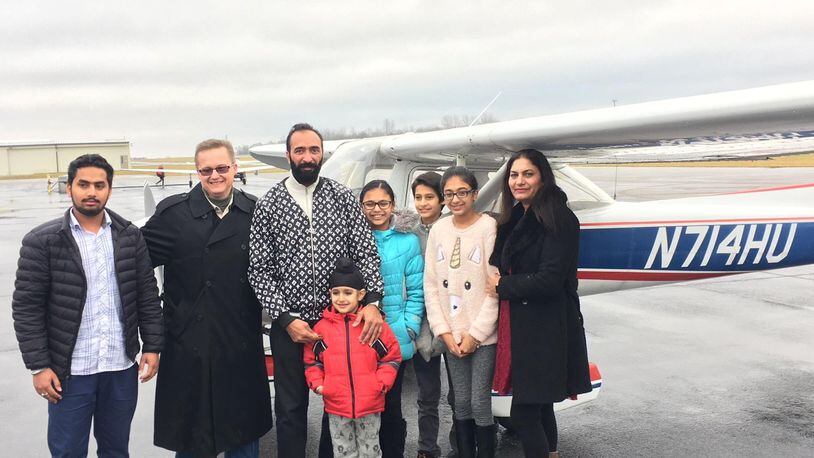 Paviter Singh and his family pictured here with Wings of Hope President and CEO Bret Heinrich Dec. 23 at the Greene County-Lewis A. Jackson Regional Airport. Contributed