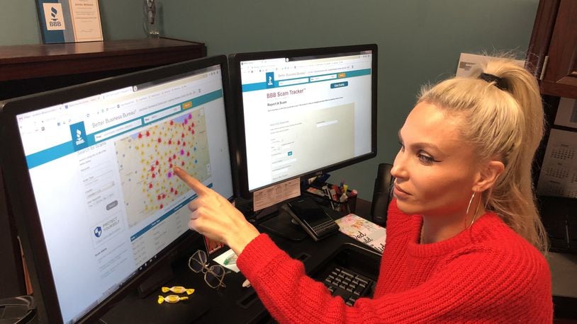 Ashlie Wilkson of the Miami Valley Better Business Bureau looks at scams on the BBB Scam Tracker. Scams increase around the holidays as consumers spend more money. JOHN NORTH for the Dayton Daily News