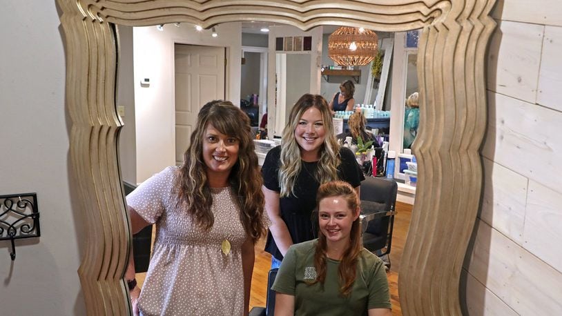 Heather Mercuri, left, owner of GLAM on the Go, will be featured in a Netflix series with fellow stylists, Emily Hanrahan, standing, and Heidi Goodbar. BILL LACKEY/STAFF