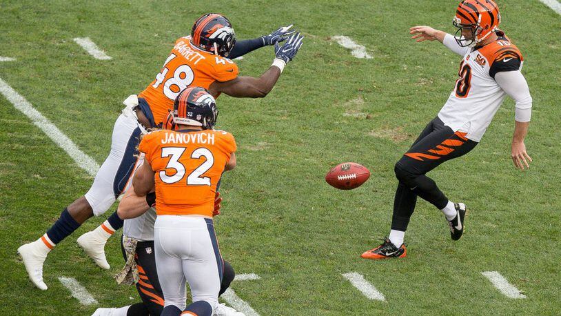 DENVER, CO - NOVEMBER 19: Outside linebacker Shaquil Barrett #48 of the Denver Broncos blocks a punt by punter Kevin Huber #10 of the Cincinnati Bengals in the first quarter of a game at Sports Authority Field at Mile High on November 19, 2017 in Denver, Colorado. (Photo by Justin Edmonds/Getty Images)