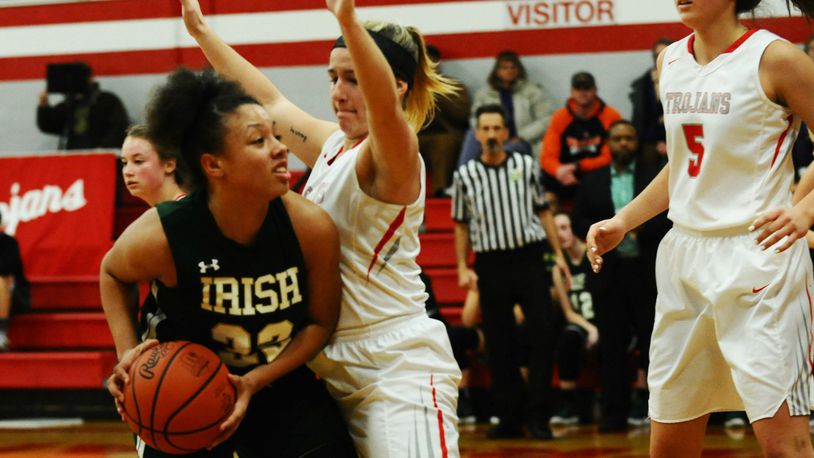Freshman Abbigail Peterson (with ball), Catholic Central’s leading scorer with 16 points per game, has helped the Irish resurgence in girls basketball. GREG BILLING / CONTRIBUTED