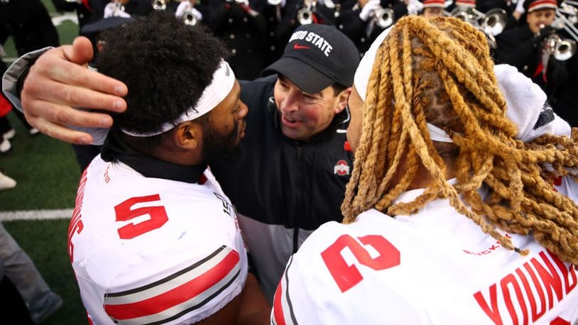 ANN ARBOR, MICHIGAN - NOVEMBER 30: Head coach Ryan Day of the Ohio State Buckeyes celebrates a 57-27 win over the Michigan Wolverines with Chase Young #2 and Baron Browning #5 at Michigan Stadium on November 30, 2019 in Ann Arbor, Michigan. (Photo by Gregory Shamus/Getty Images)