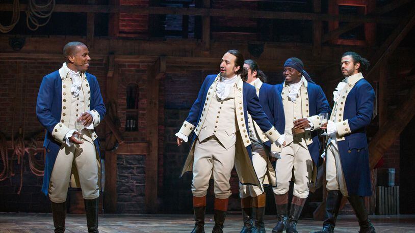 FILE -- From left, Leslie Odom Jr., Lin-Manuel Miranda, Anthony Ramos, Okieriete Onaodowan and Daveed Diggs in "Hamilton" at the Richard Rodgers Theater in New York, July 11, 2015. Disney announced Tuesday, May 12, 2020, that it plans to stream a filmed version of the stage production beginning July 3 on Disney Plus. (Sara Krulwich/The New York Times)