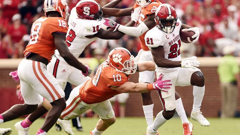 Clemson linebacker Ben Boulware tries to tackle N.C. State running back Matthew Dayes on October 15, 2016 at Memorial Stadium in Clemson, South Carolina. (Photo by Todd Bennett/Getty Images)