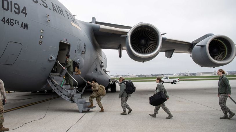 A doctor and several nurses from the 445th Airlift Wing’s Aerospace Medicine and Aeromedical Staging Squadrons, board a C-17 Globemaster III here April 5, 2020 heading to Joint Base McGuire-Dix-Lakehurst. (U.S. Air Force photo/Mr. Patrick O’Reilly)