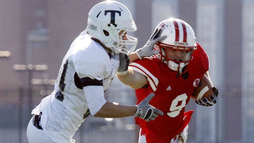 Corey Weber (9) of Wittenberg is pursued by Ryan Rickaby (24) of Trine during Saturday’s second-round Division III playoff football game at Edwards-Maurer Field on Nov. 28, 2009. Wittenberg won the game 34-17. Staff Photo by Barbara J. Perenic