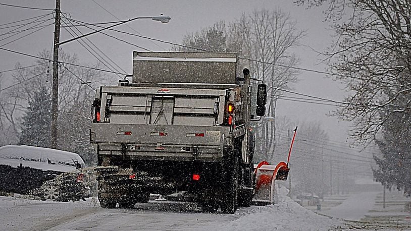 A Clark County plow works on roads Saturday morning as a winter storm moved into the area. STAFF/MARSHALL GORBY