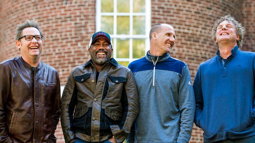 In this Nov. 16, 2018 photo, Dean Felber, from left, Darius Rucker, Jim Sonefeld, and Mark Bryan, of Hootie & the Blowfish, pose for a portrait at the University of South Carolina in Columbia, S.C. The band is returning with a tour and album 25 years after “Cracked Rear View” launched the South Carolina-based rock band.