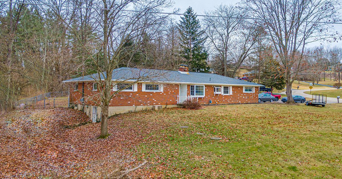 Full brick ranch has 4 bedrooms, possible fifth